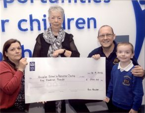 Arvalee School Presented with a cheque for £500